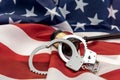 Gavel and handcuff lying flag of usa. Illegal concept Royalty Free Stock Photo