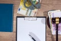 Gavel,handcuffs and euro money with empty notepad on desk.