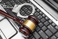 Gavel with handcuffs on the laptop keyboard. Online law and crime concept Royalty Free Stock Photo