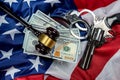 Gavel and handcuffs and money and gun on the background of the American flag of the USA. Royalty Free Stock Photo