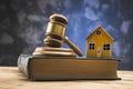 Gavel with house model on book Royalty Free Stock Photo