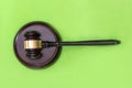 gavel isolated on green background