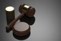 Gavel judge with stack of coins