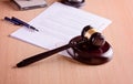 Gavel and judgement on desk. Royalty Free Stock Photo