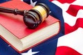 Gavel with law book on american flag. Close up Royalty Free Stock Photo