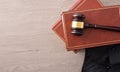 Gavel on lawbooks and toga on wooden table