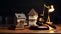 Gavel and model house on the table