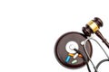 Gavel with pills and stethoscope on white. Top view. Copy space Royalty Free Stock Photo