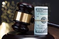 Gavel with rolled banknote Royalty Free Stock Photo