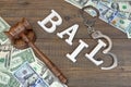 Gavel, Sign BAIL, Handcuffs And Dollar Cash On Wood Background Royalty Free Stock Photo