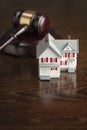 Gavel and Small Model House on Table