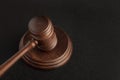 Gavel and sounding block. Black background. Justice and law concept