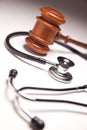 Gavel and Stethoscope on Gradated Background