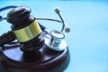 Gavel and stethoscope. medical jurisprudence. legal definition of medical malpractice. attorney. common errors doctors