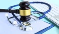 Gavel and stethoscope. medical jurisprudence. legal definition of medical malpractice. attorney. common errors doctors