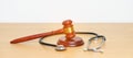 Gavel and stethoscope on table. Medical and Health Law, legal of medical malpractice concept Royalty Free Stock Photo