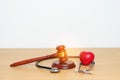 Gavel and stethoscope on table. Medical and Health Law, legal of medical malpractice concept Royalty Free Stock Photo