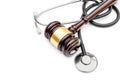 Gavel with stethoscope on white. Top view. Copy space. Medical law Royalty Free Stock Photo