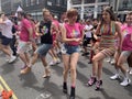 Gay activists dancing with LGBT flags at the Pride parade in London , England 2023