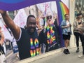 Gay activists with LGBT flags at the Pride parade in London , England 2023