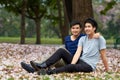 Gay, Asian men and couple in park, nature date and life together with homosexual, pride and happiness. Young male people Royalty Free Stock Photo