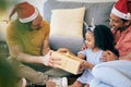 Gay, Christmas and a father with a gift for a child, celebration and holiday as a family. Smile, home and an lgbt man Royalty Free Stock Photo