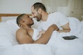 Gay couple cuddling in bed Royalty Free Stock Photo