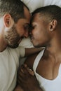 Gay couple cuddling in bed Royalty Free Stock Photo