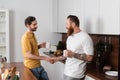 Gay couple with cups of coffee Royalty Free Stock Photo