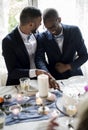 Gay Couple Cutting Cake Together on Wedding Reception Royalty Free Stock Photo