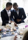 Gay Couple Cutting Cake Together on Wedding Reception Royalty Free Stock Photo