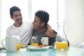 Gay Couple Eating Breakfast At Home In the Morning Royalty Free Stock Photo