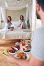 Gay couple in bed having  breakfast in bed  together Royalty Free Stock Photo