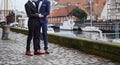 Gay couple holding hands, LGBT wedding