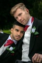 Gay weddings, grooms, couples pose for pictures after their wedding ceremony in churchyard Royalty Free Stock Photo