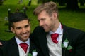 Gay weddings, grooms, couples pose for pictures after their wedding ceremony in churchyard Royalty Free Stock Photo