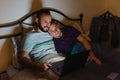 Gay couple looking at laptop in bed Royalty Free Stock Photo