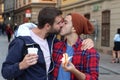 Gay couple passionately kissing on the street