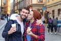 Gay couple passionately kissing on the street