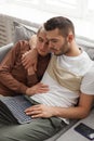 Gay Couple Relaxing at Home on Sofa Royalty Free Stock Photo