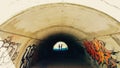 Gay couple in a tunnel holding hands