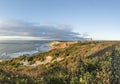 Gay Head Lighthouse and Gay Head cliffs of clay at the westernmost point of Martha`s Vineyard in Aquinnah Royalty Free Stock Photo