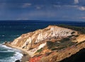 Gay Head`s colorful cliffs glow in the sun during a rain squall