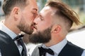 Gay kiss on wedding. Marriage gay couple tender kissing. Close up portrait of gay kissed. Portrait of gay couple in love Royalty Free Stock Photo