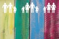 Gay lesbian and straight families on wooden coloured background