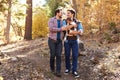 Gay Male Couple With Baby Walking Through Fall Woodland Royalty Free Stock Photo