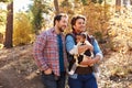 Gay Male Couple With Baby Walking Through Fall Woodland Royalty Free Stock Photo