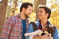 Gay Male Couple With Baby Walking Through Fall Woodland Royalty Free Stock Photo