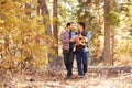 Gay Male Couple With Baby Walking Through Fall Woodland Royalty Free Stock Photo