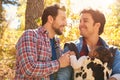 Gay Male Couple With Baby Walking Through Fall Woodland Royalty Free Stock Photo